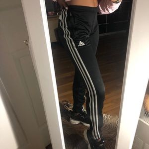 Unisex Adidas track pants.